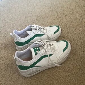Green and white sneakers